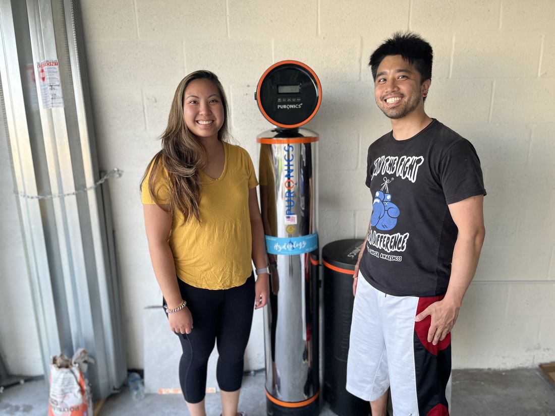 Happy local homeowners with their new Hydrology water treatment system