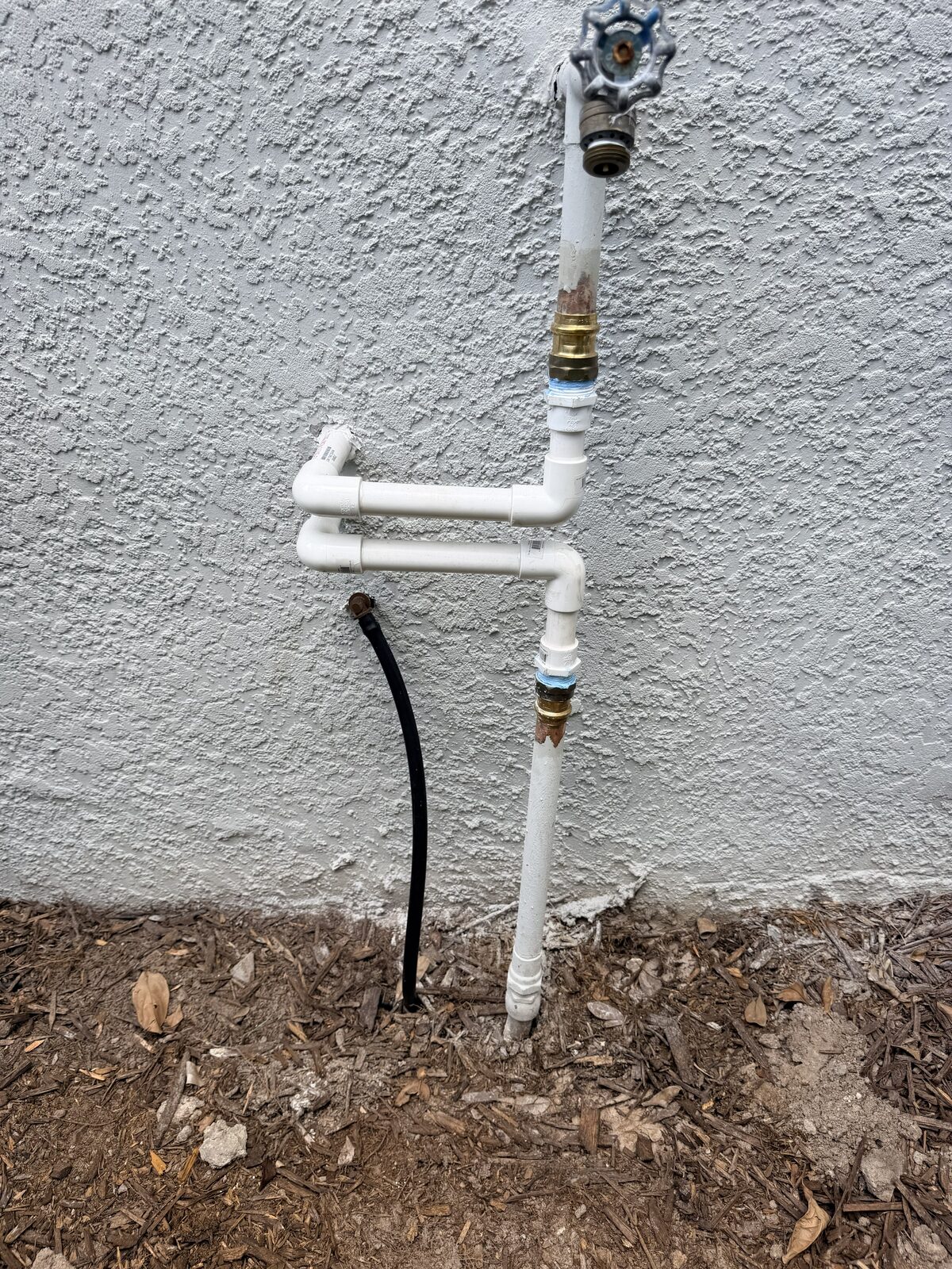 Exterior water treatment plumbing and bypass loop