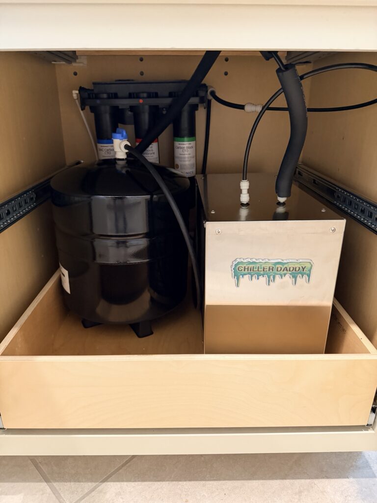 Chiller Daddy chilled water unit installed under a sink beside a Puronics RO system