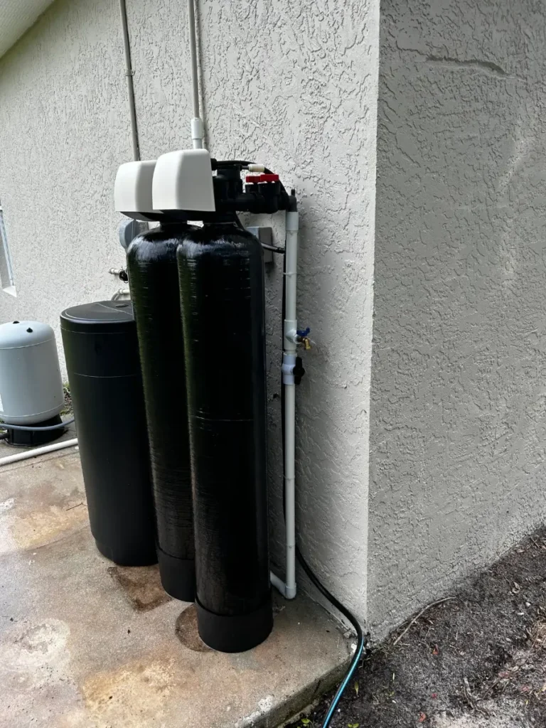 Multi-tank water treatment system with brine tank and pressure tank installed by Hydrology Water Solutions