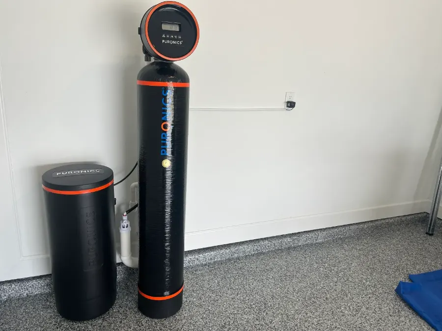 Puronics whole-home water softener installed in a Bradenton-area garage