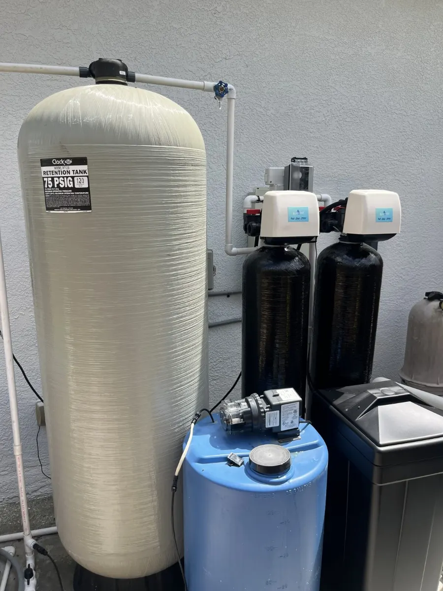 Well water iron and sulfur treatment system with multiple tanks