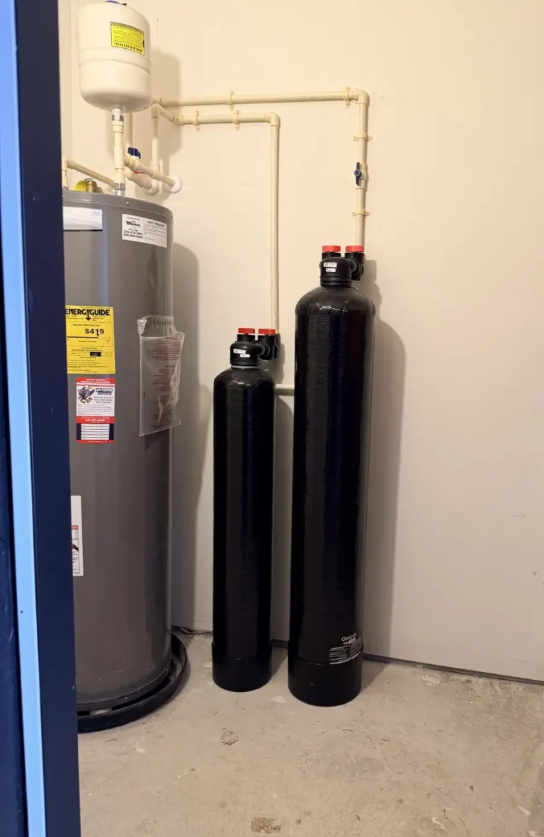 Whole-house filtration system in a condo serviced by Hydrology Water Solutions — service-call photo, not Hydrology equipment