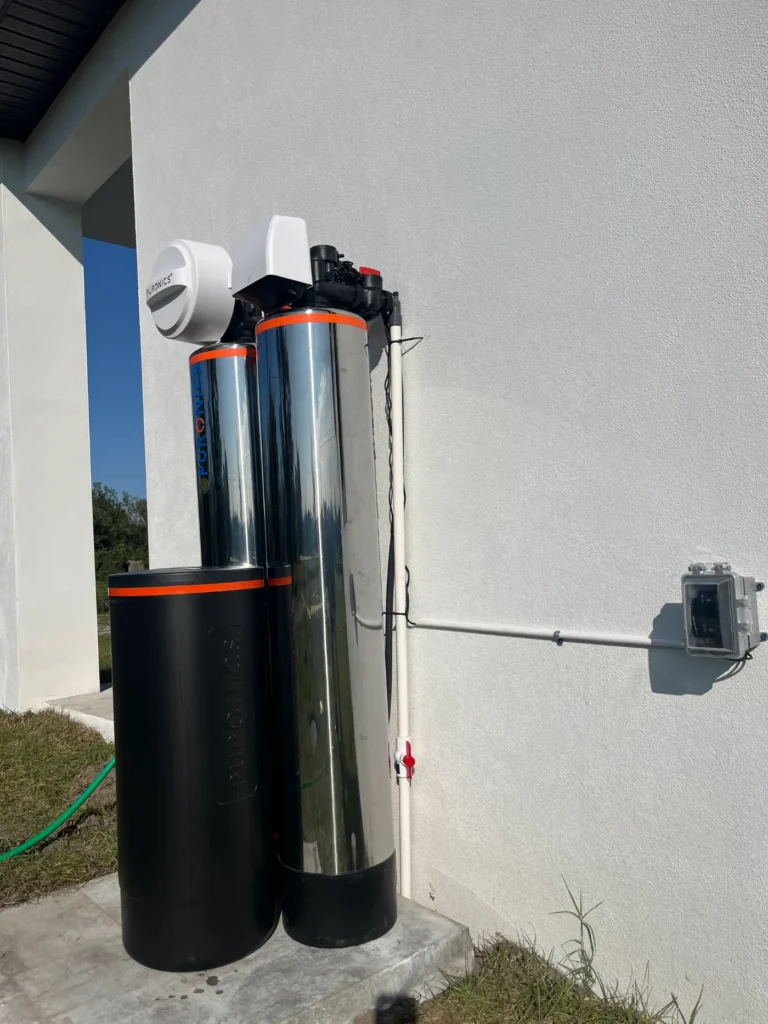 Puronics whole-home water treatment system at a new construction home, stainless tanks with brine tank and bypass valve