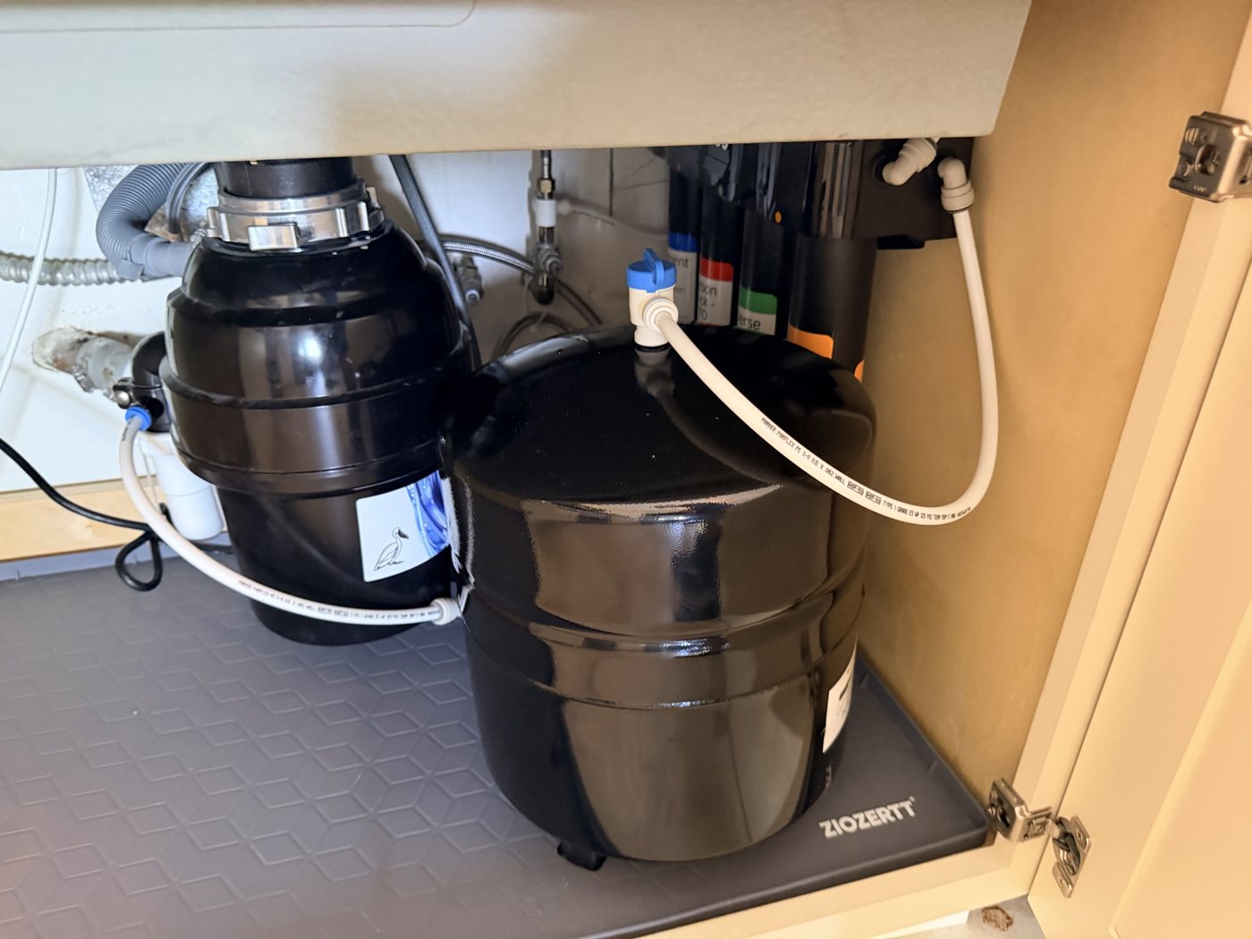 Puronics Micromax 8500 reverse osmosis system installed under a kitchen sink in St. Petersburg