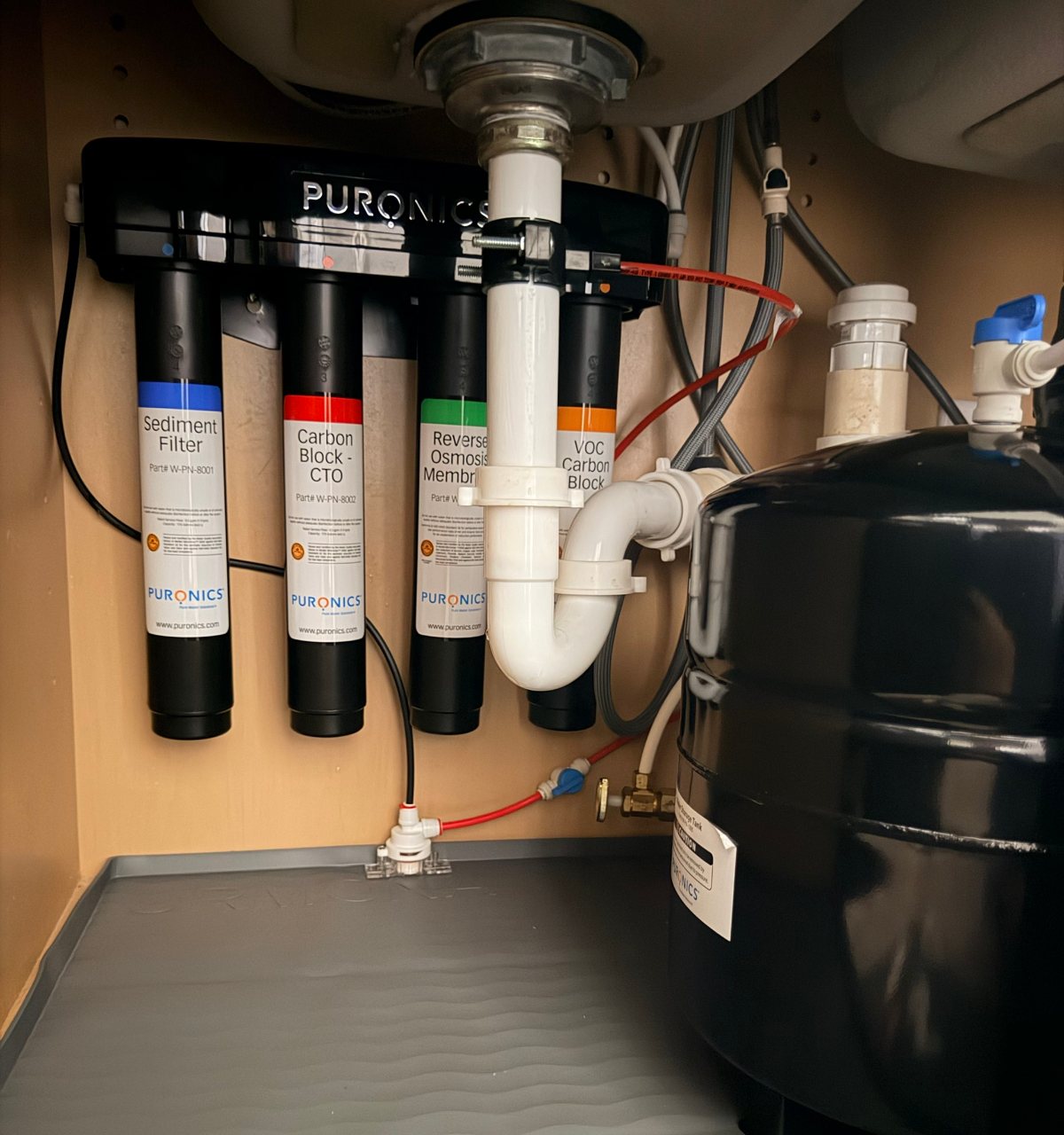 Puronics Micromax 8500 reverse osmosis system installed under a kitchen sink in Wimauma