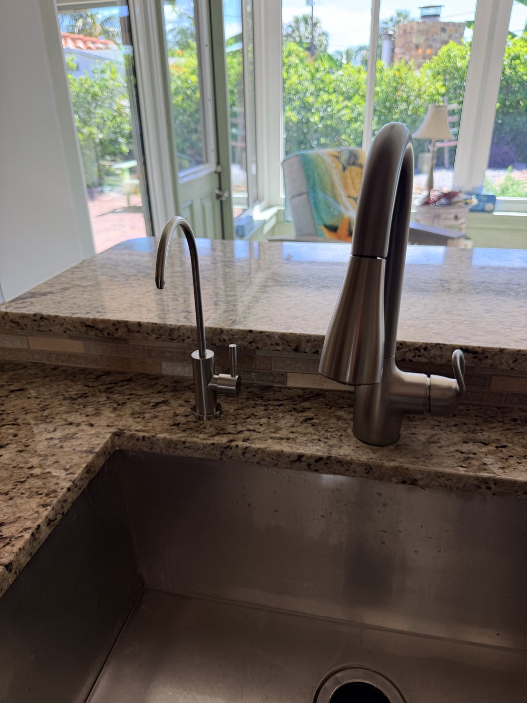 Reverse osmosis drinking water faucet installed beside the kitchen faucet in a St. Pete Beach home