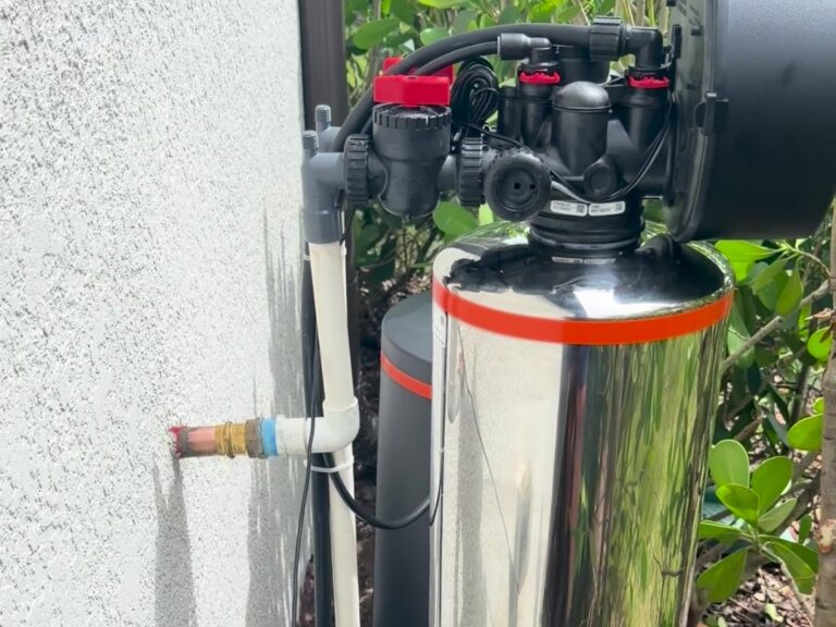 Puronics Hydronex whole-home water system with pressed copper connection installed outside a home in Lakewood National, Lakewood Ranch, Florida