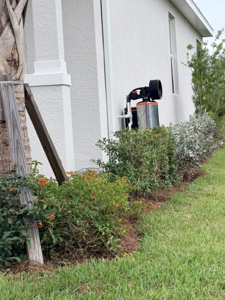 Puronics Hydronex whole-home water system installed outside a home in Parrish, Florida