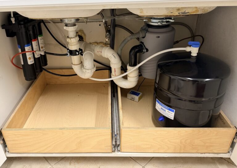 Puronics Micromax 7000 reverse osmosis system and storage tank installed under a kitchen sink in Bradenton, Florida